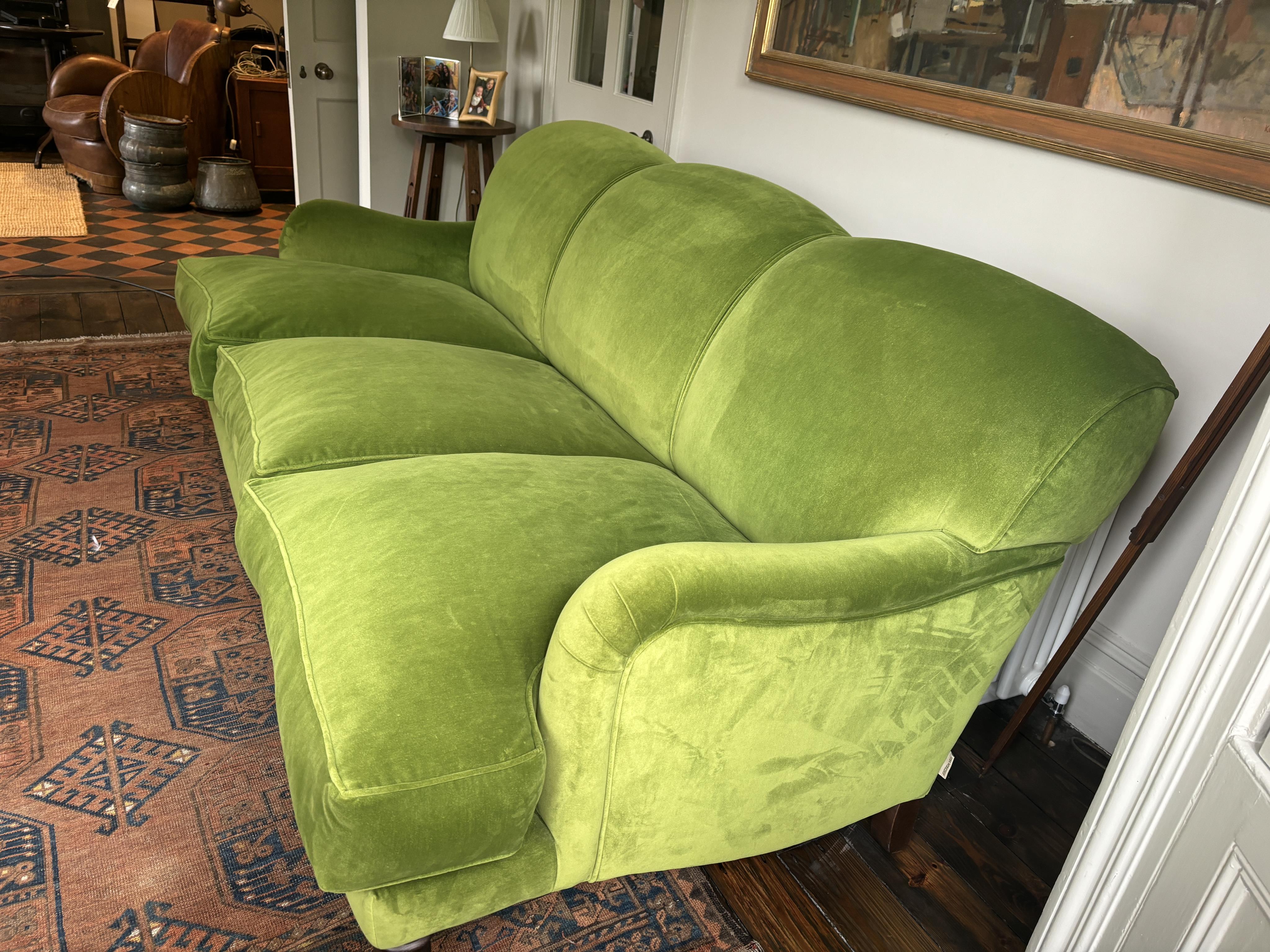 A Sofa Workshop 'Lady May' English roll arm green velvet four seater settee, Howard style sofa, seating generously feather filled, width 200cm, depth 110cm, height 84cm seat height 48cm. Condition - very good